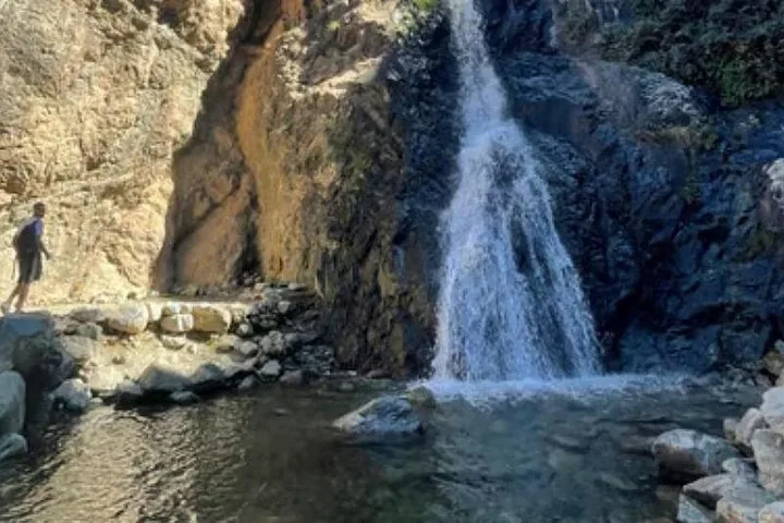 Hiker Standing Near Ourika Waterfalls in the Mountains
